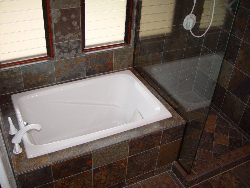 The master bath with soaking tub and walk-in shower