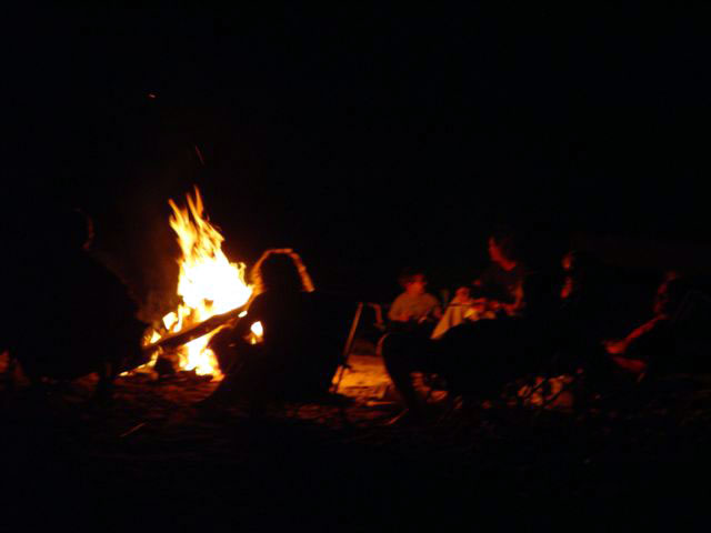 Beach fire gathering in front of the property